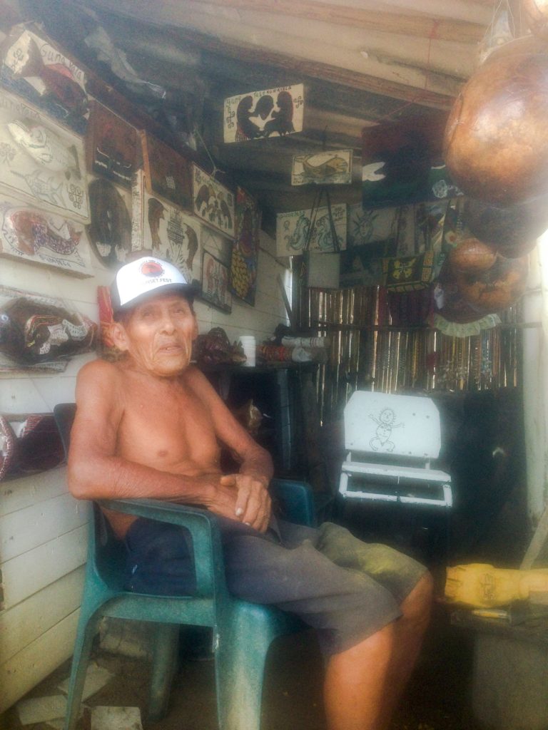 Sweet Kuna man carving wood