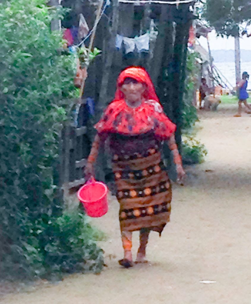 Kuna woman walking in standard outfit for women