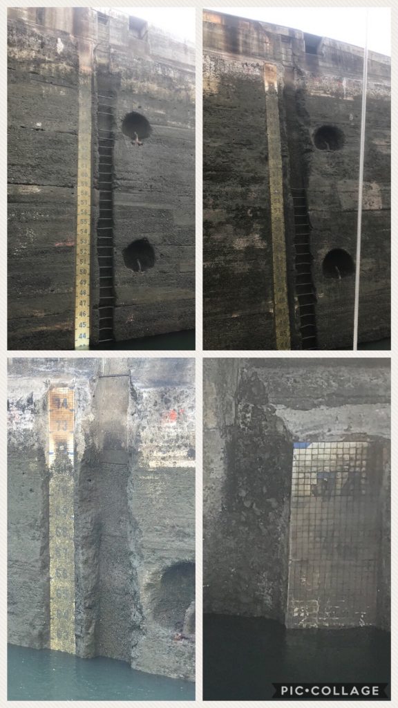 Water level indicators on canal wall.