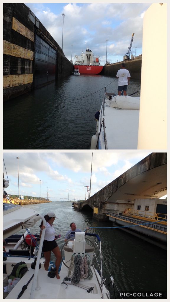 Panama line handlers walking our nested boats to center chamber.