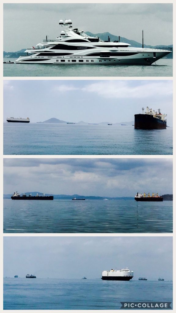 Large cargo ships & yachts in La Playita anchorage.