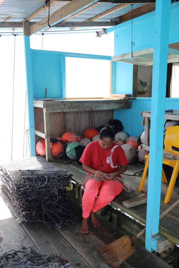 Working on nets for pearl harvesting
